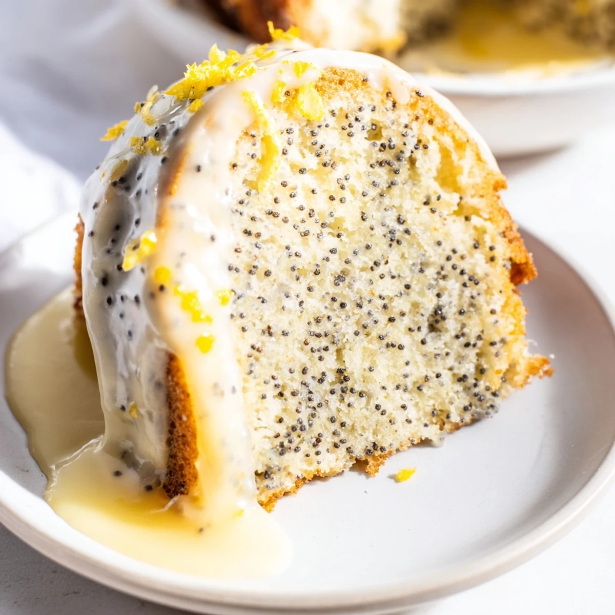 This delicious, American-style Lemon Poppy Seed Bundt Cake is perfect for dessert or a treat.