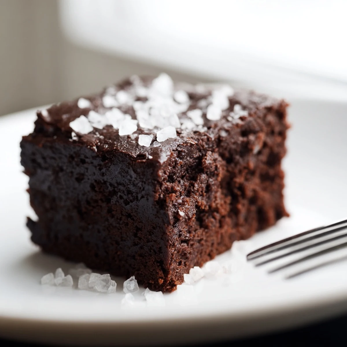 Warm Chocolate Fudge Brownies with Sea Salt cooling on a wire rack after baking.
