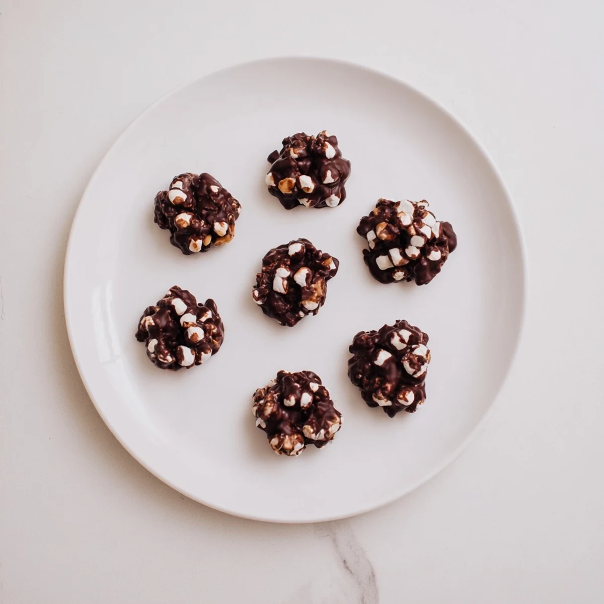 Homemade Peanut Marshmallow Clusters cooling on a baking sheet, perfect for dessert platters or sharing with friends.