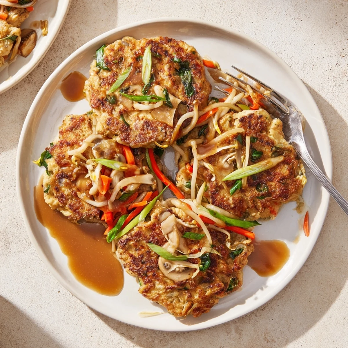 Fluffy vegetable packed Egg Foo Young omelets fried until perfectly crispy and golden