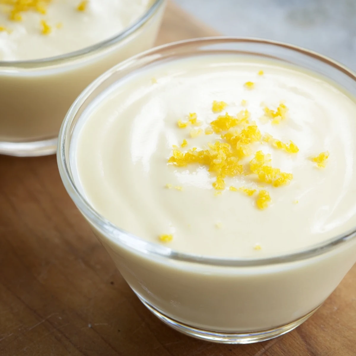 British lemon posset with velvety texture served chilled with mint sprigs