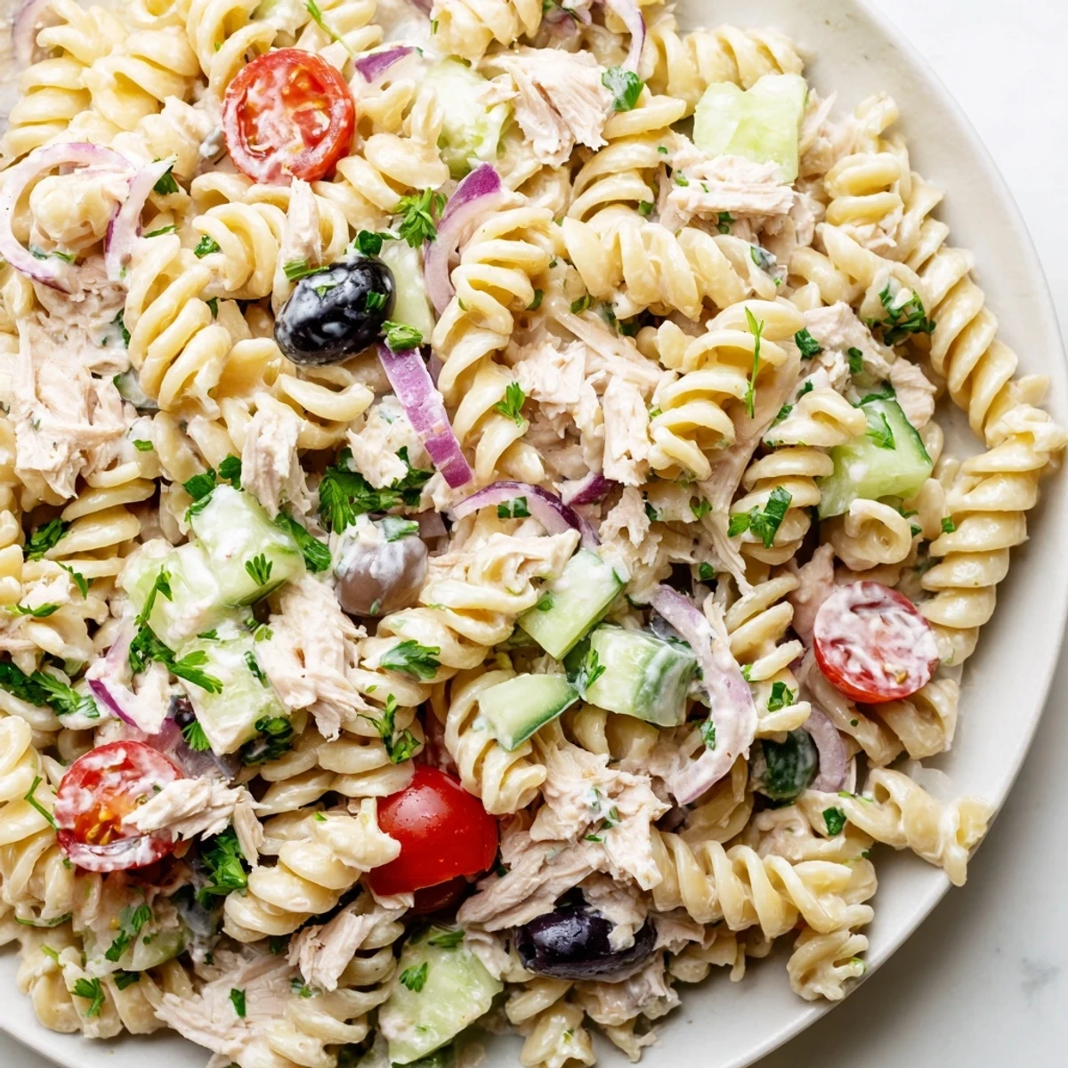 Creamy tuna pasta salad loaded with crisp vegetables in a zesty mayonnaise dressing