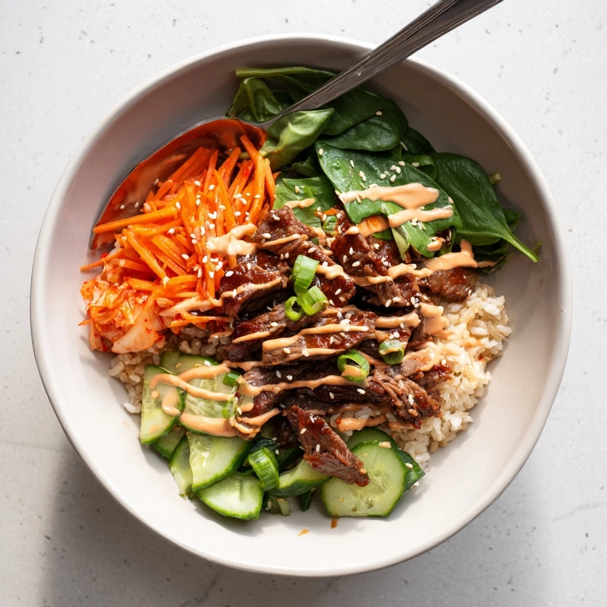 Sizzling caramelized steak over fluffy jasmine rice in Korean BBQ steak rice bowls
