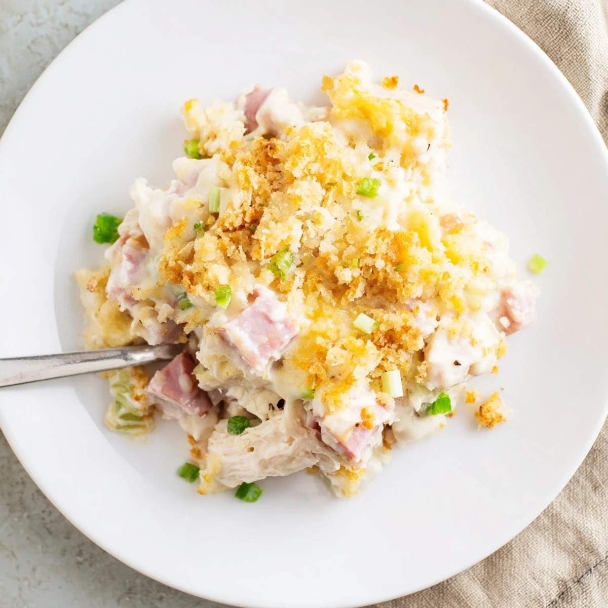 Golden, bubbling Chicken Cordon Bleu Casserole with melted Swiss and crunchy breadcrumb topping