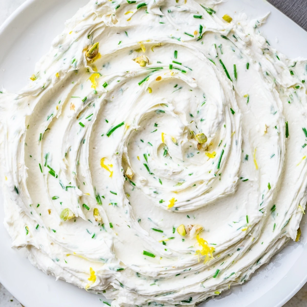 Grazing table highlight: Rustic Creamy Herb Infused Butter Board sprinkled with pistachios