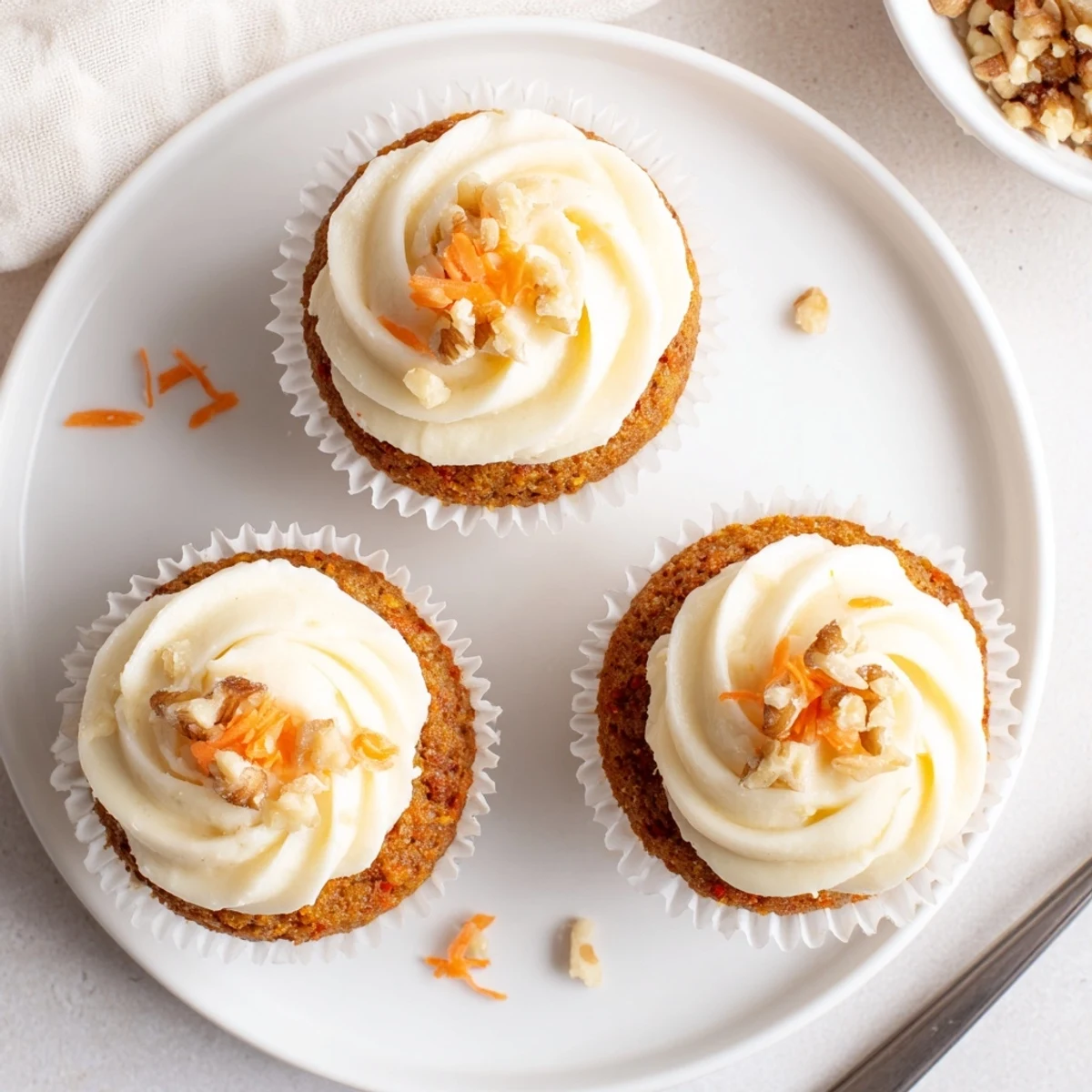 Freshly baked Moist Carrot Cake Cupcakes with creamy frosting and cinnamon aroma.