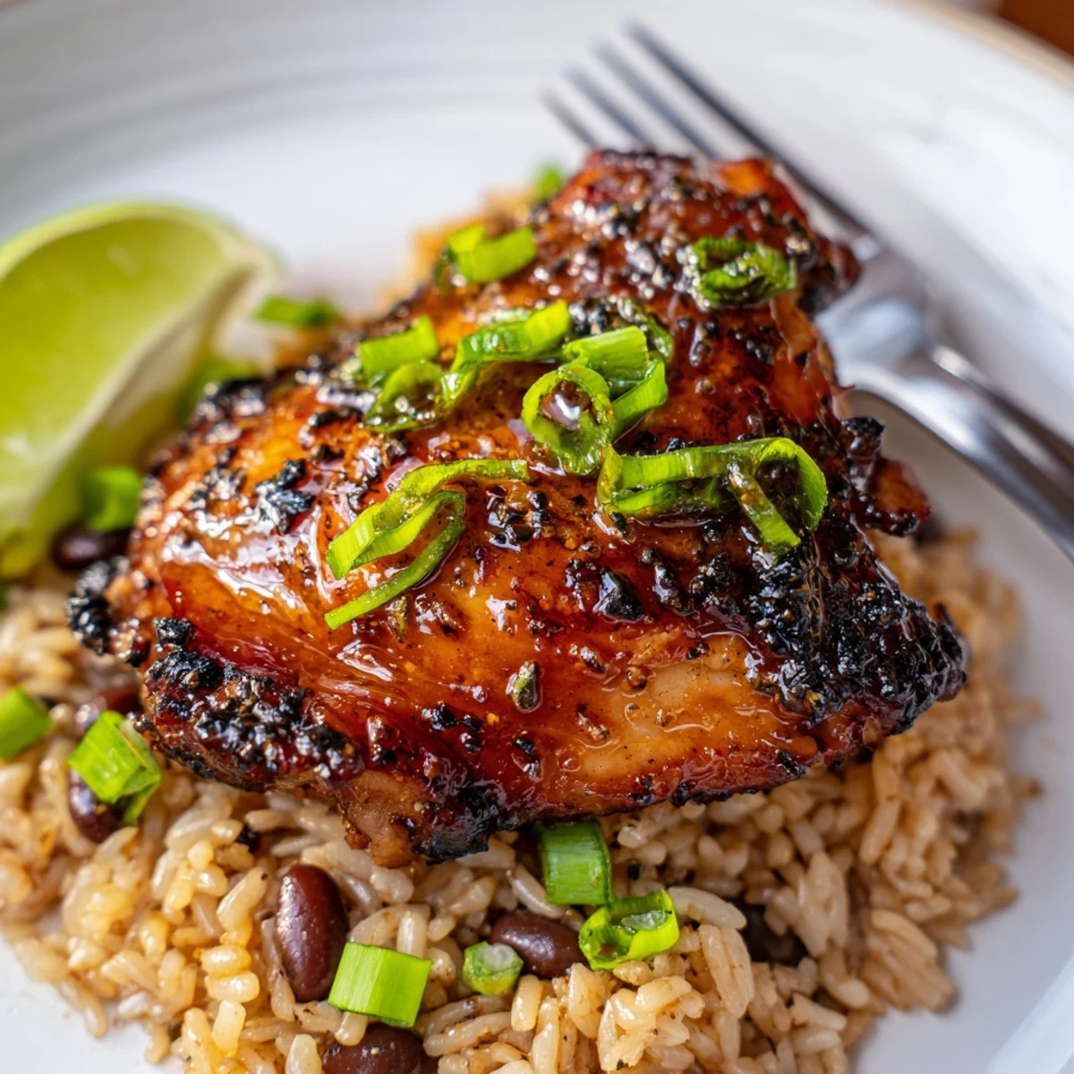 Grilled Caribbean Jerk Chicken And Rice with spicy Scotch bonnet glaze and lime.