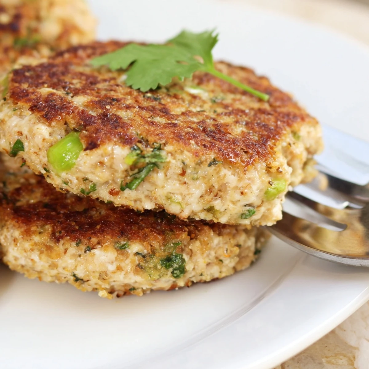 Golden brown Asian tuna cakes pan-fried to crispy perfection with spicy mayo dipping sauce
