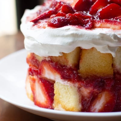 Freshly sliced strawberries and light whipped cream crown this classic Strawberry Shortcake Trifle for a festive summer dessert spread.  